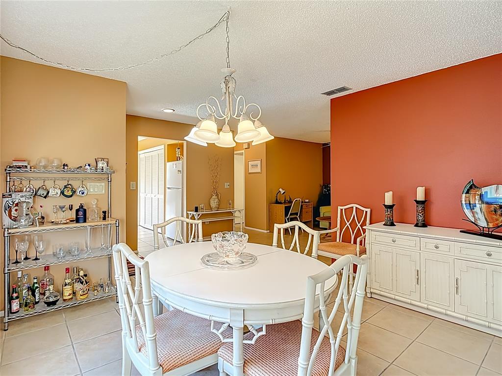 12924 Wedgewood Way, Unit D Hudson, FL 34667 - Photo 11 of 69 a view of a dining room with furniture window and outside view