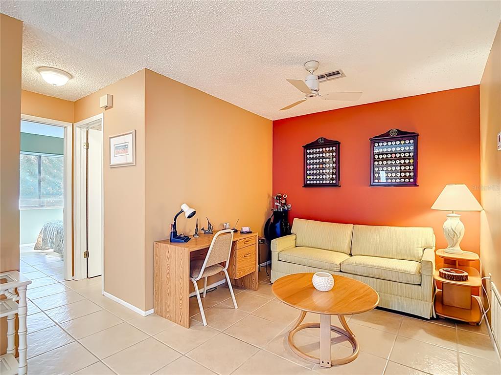 12924 Wedgewood Way, Unit D Hudson, FL 34667 - Photo 19 of 69 a living room with furniture and a rug