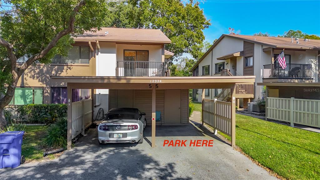 12924 Wedgewood Way, Unit D Hudson, FL 34667 - Photo 3 of 69 a front view of a house with a yard