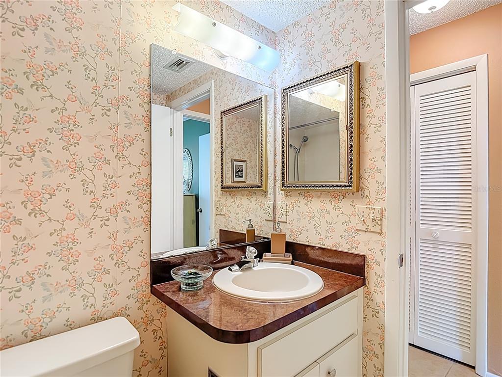 12924 Wedgewood Way, Unit D Hudson, FL 34667 - Photo 33 of 69 a bathroom with a sink and a mirror