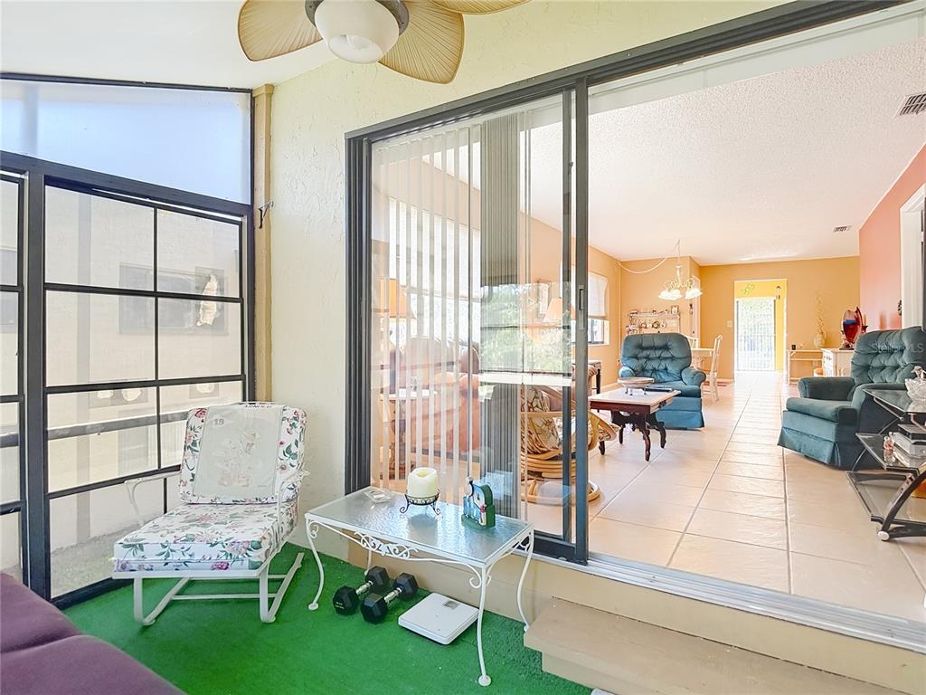 12924 Wedgewood Way, Unit D Hudson, FL 34667 - Photo 42 of 69 a living room with furniture and a large window