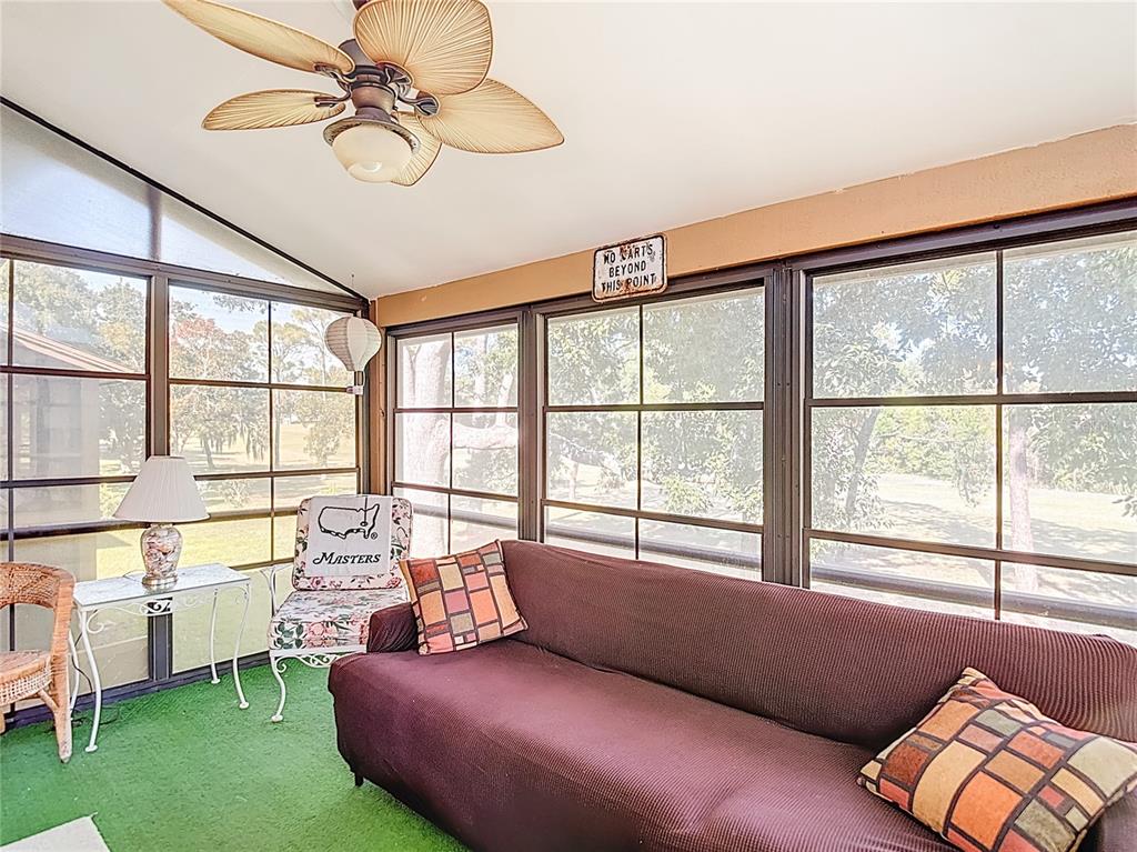 12924 Wedgewood Way, Unit D Hudson, FL 34667 - Photo 44 of 69 a living room with furniture and a window