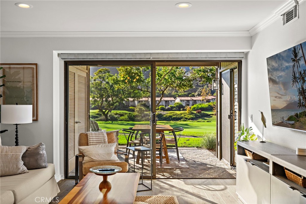 31421 East Nine Drive, Unit 79A Laguna Niguel, CA 92677 - Photo 11 of 31 a living room with patio furniture and a garden