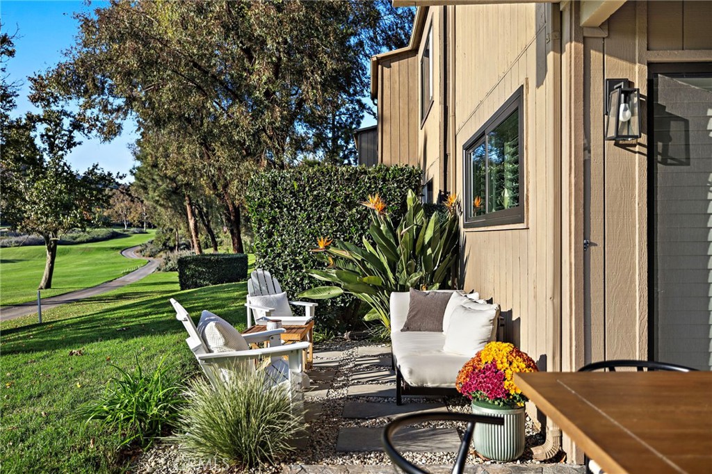 31421 East Nine Drive, Unit 79A Laguna Niguel, CA 92677 - Photo 14 of 31 a view of a chair and table in backyard of the house