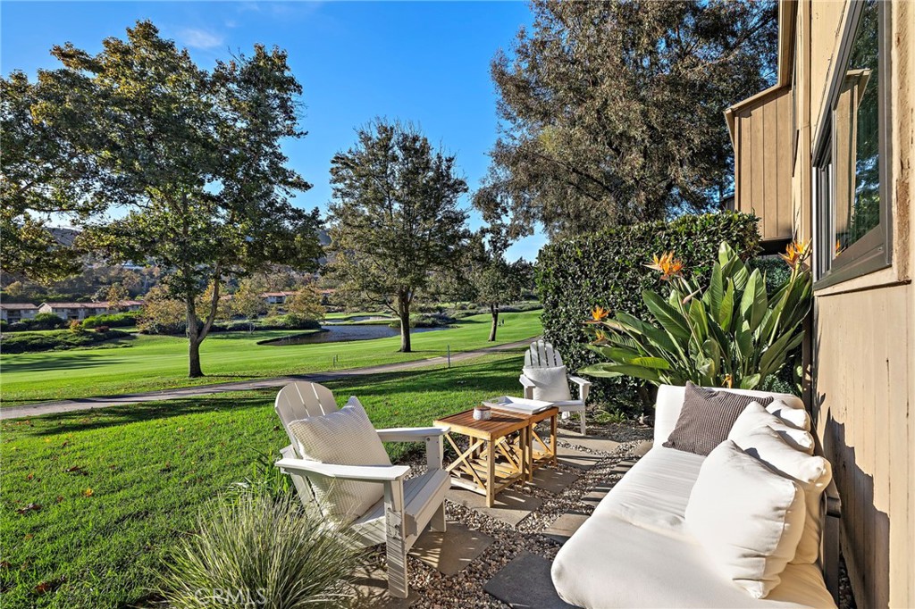 31421 East Nine Drive, Unit 79A Laguna Niguel, CA 92677 - Photo 15 of 31 a view of a table and chairs in the garden