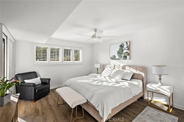 a bedroom with bed and a window