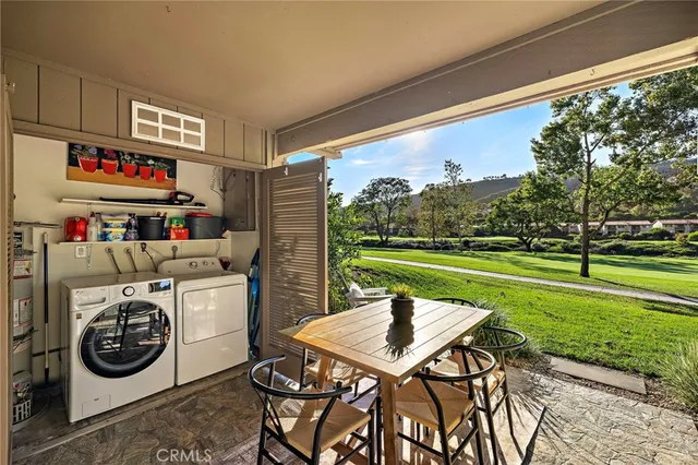a view of a porch with furniture and garden