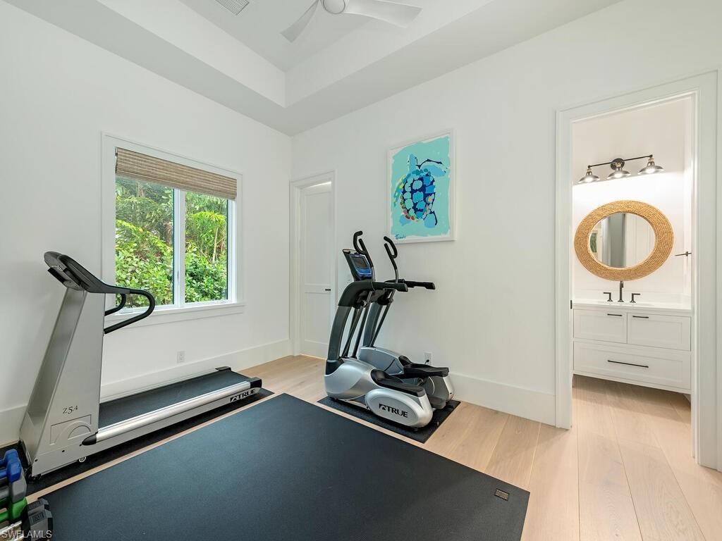 282 Bahia Point Naples, FL 34103 - Photo 26 of 38 a room with gym equipment and a window