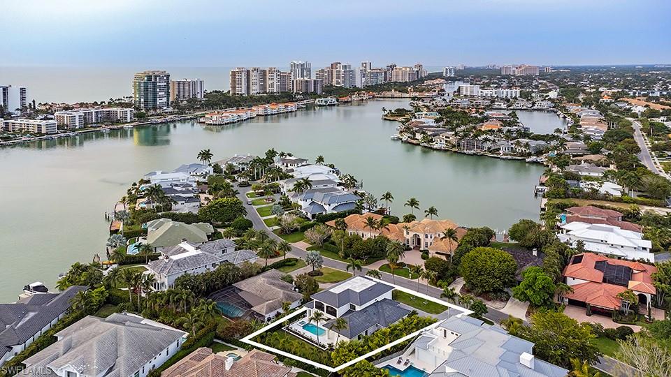 282 Bahia Point Naples, FL 34103 - Photo 38 of 38 an aerial view of a city with lake view