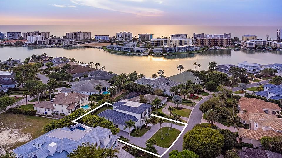 282 Bahia Point Naples, FL 34103 - Photo 4 of 38 a view of a lake and a city