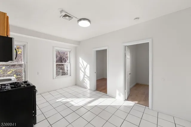 a view of livingroom with furniture and flat screen tv