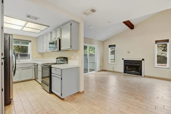 a kitchen with a stove and a sink