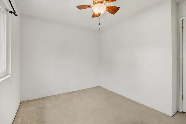 a view of a small space with a fan