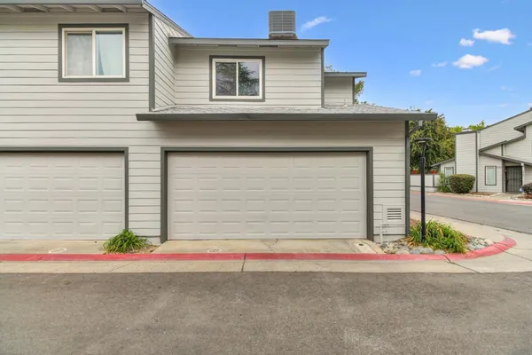 a front view of a house with garage