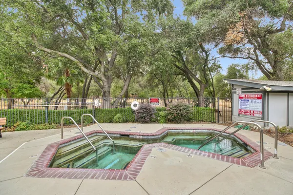 a view of yard with swimming pool and furniture