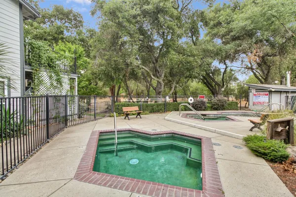 a view of a yard with swimming pool