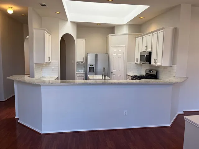 a kitchen with counter top and outdoor space