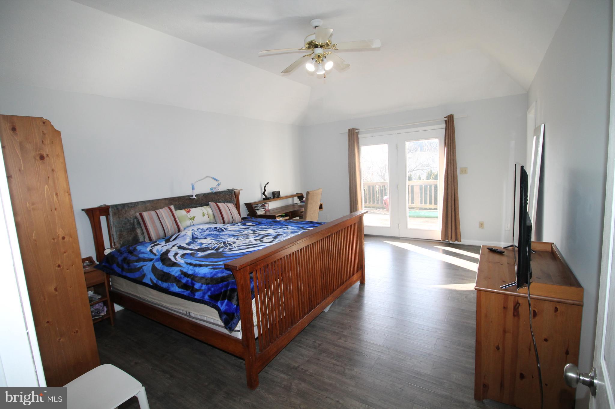 301 Huntersridge Road Winchester, VA 22602 - Photo 12 of 51 Master bedroom in back of home, doors lead to deck
