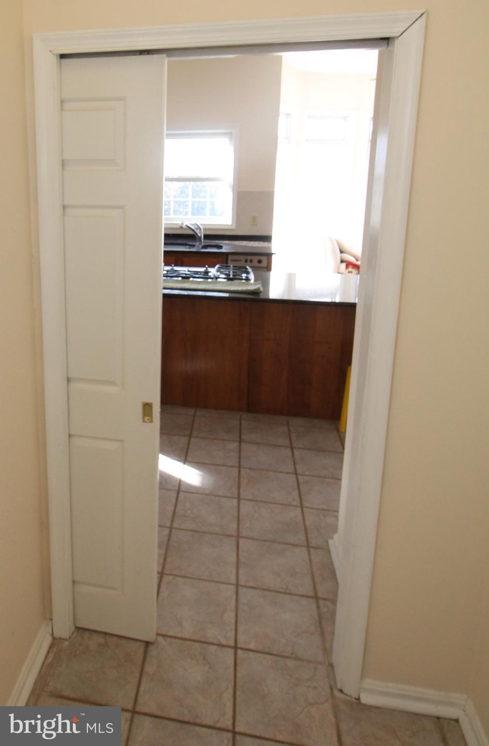 301 Huntersridge Road Winchester, VA 22602 - Photo 16 of 51 Pocket door separating kitchen from laundry, etc.