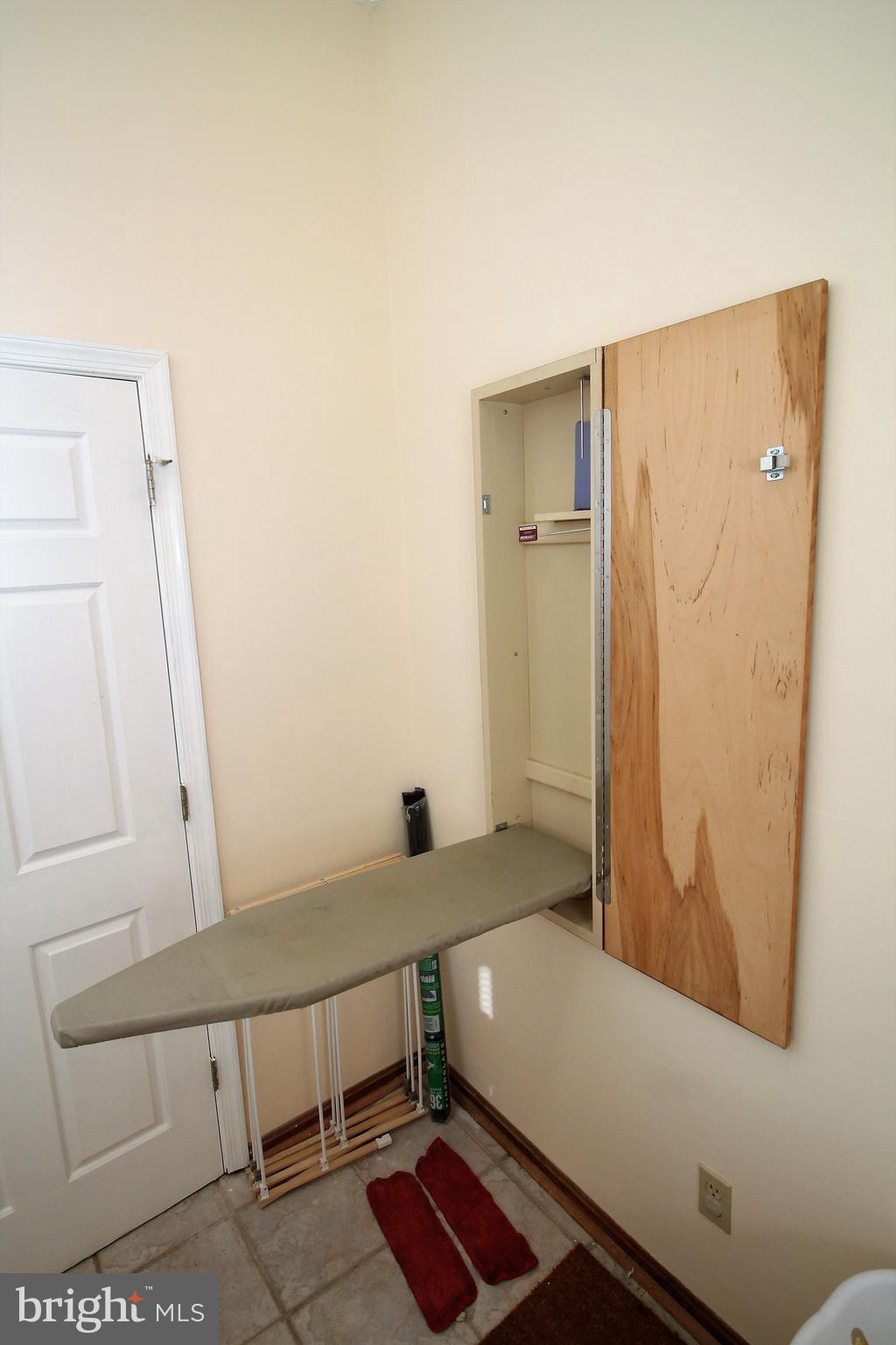 301 Huntersridge Road Winchester, VA 22602 - Photo 18 of 51 Fold down ironing board in the laundry room.