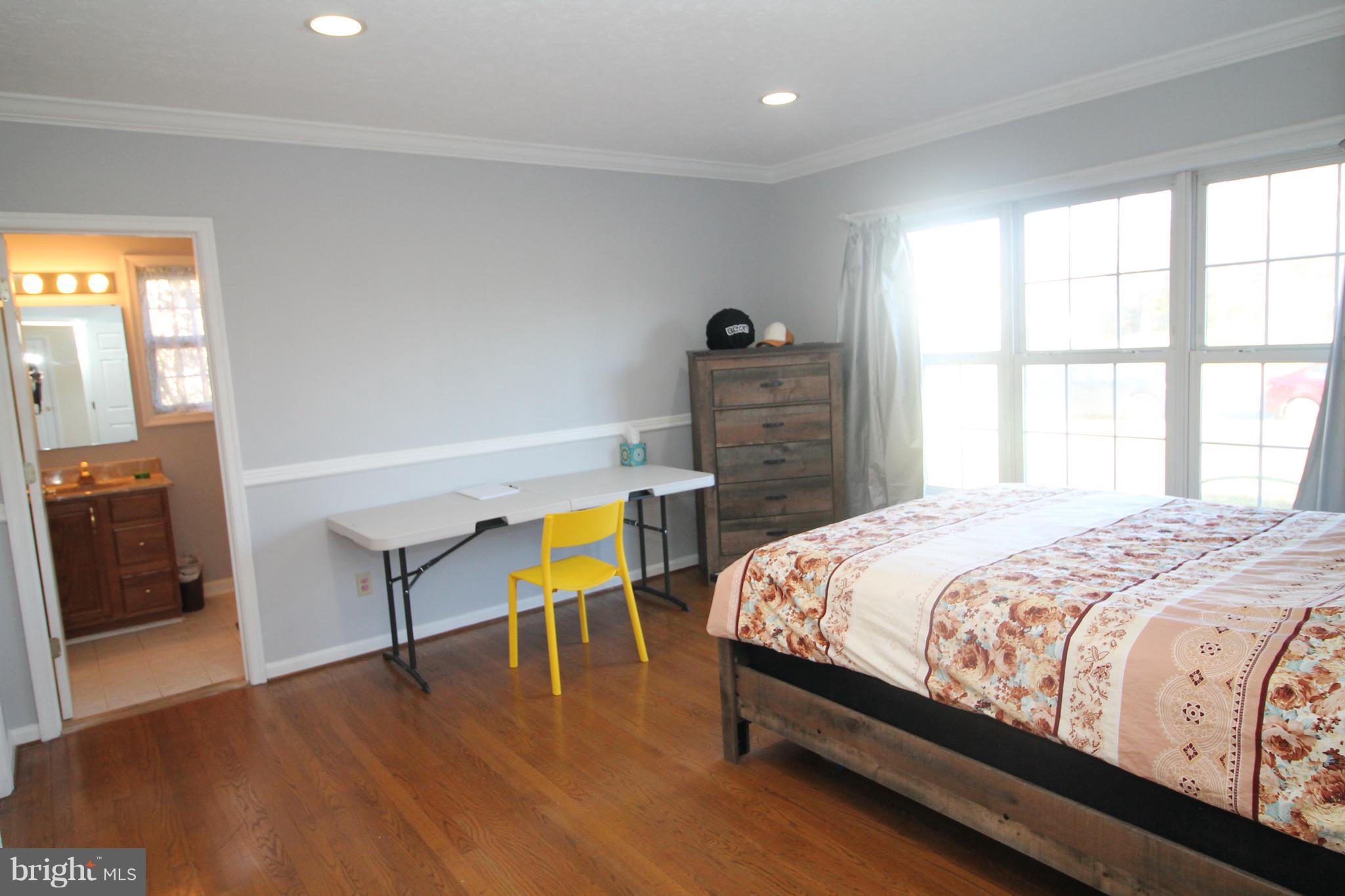 301 Huntersridge Road Winchester, VA 22602 - Photo 20 of 51 Front bedroom, with bathroom, has plenty of light.