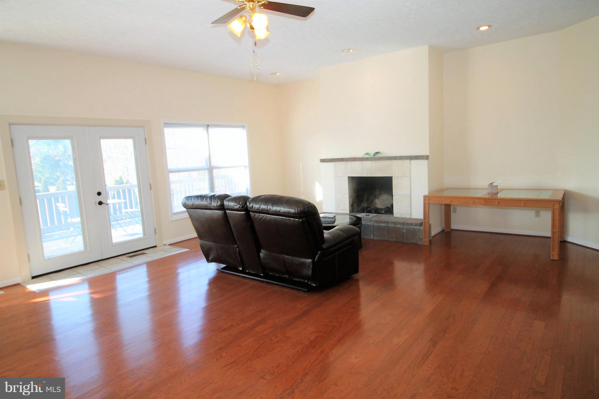 301 Huntersridge Road Winchester, VA 22602 - Photo 6 of 51 Large living room with fireplace.
