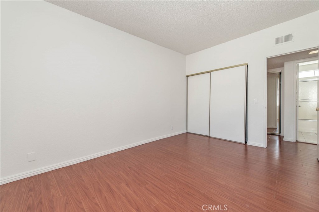 24320 Sylvan Glen Road, Unit E Diamond Bar, CA 91765 - Photo 13 of 20 a view of an empty room with wooden floor