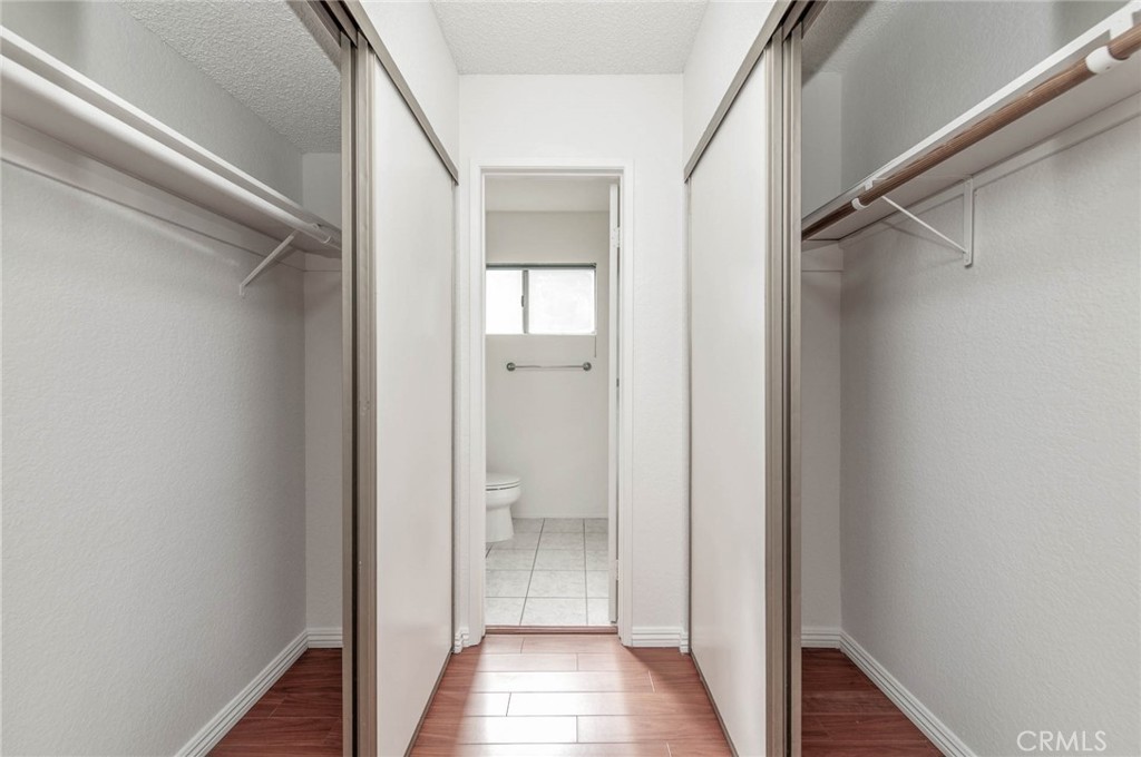 24320 Sylvan Glen Road, Unit E Diamond Bar, CA 91765 - Photo 16 of 20 a view of a hallway with wooden floor and staircase