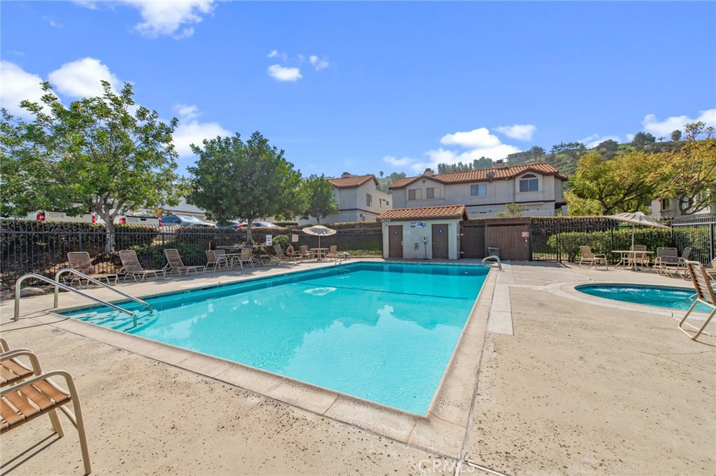 24320 Sylvan Glen Road, Unit E Diamond Bar, CA 91765 - Photo 17 of 20 a view of a house with a swimming pool
