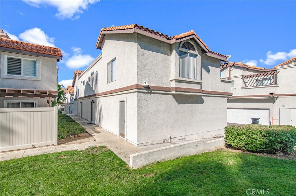 24320 Sylvan Glen Road, Unit E Diamond Bar, CA 91765 - Photo 2 of 20 a view of a house with a white fence