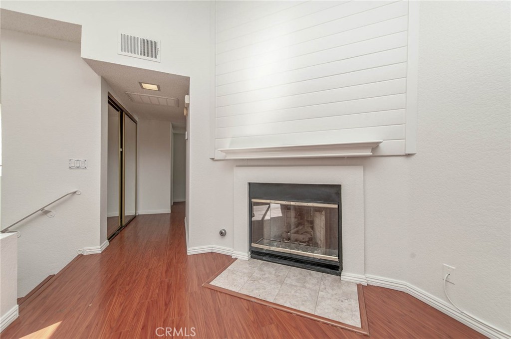 24320 Sylvan Glen Road, Unit E Diamond Bar, CA 91765 - Photo 7 of 20 a view of a livingroom with wooden floor and a fireplace