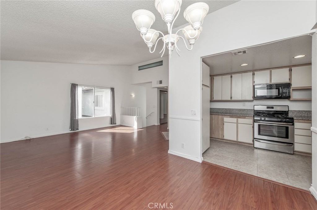 24320 Sylvan Glen Road, Unit E Diamond Bar, CA 91765 - Photo 10 of 20 a view of a kitchen with a microwave and a stove