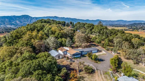 an aerial view of a house with mountain view