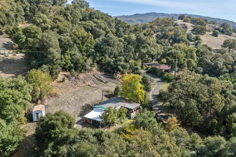 an aerial view of residential house with outdoor space