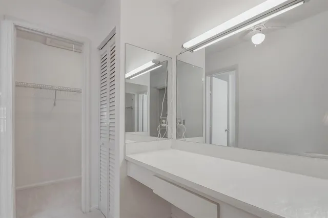 a bathroom with a shower and a sink