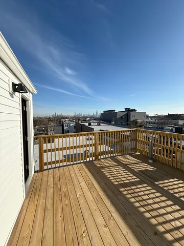 a view of balcony with wooden floor
