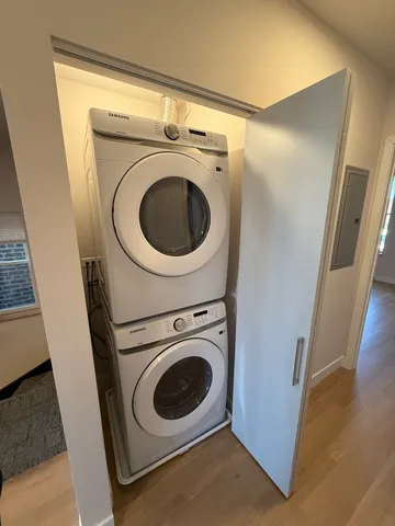 a bathroom with a double vanity sink toilet and a mirror