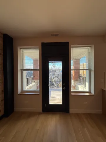 a view of an empty room with a window
