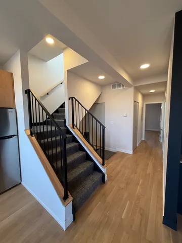 a view of a hallway with staircase