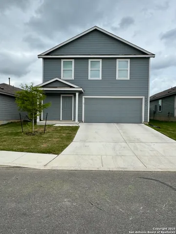 a front view of a house with yard