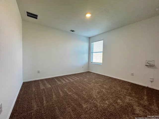 en empty room with windows