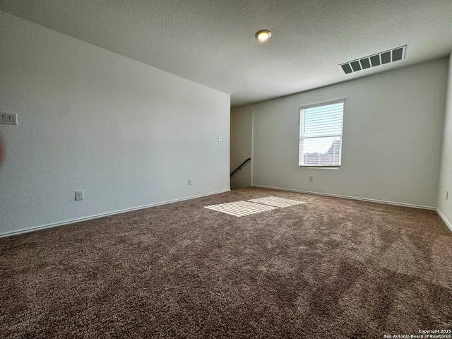 a bathroom with a bathtub and a toilet
