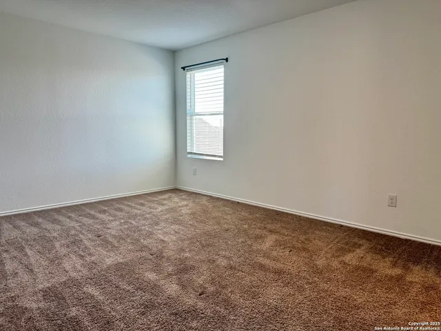 a kitchen with stainless steel appliances granite countertop a refrigerator a stove and a sink