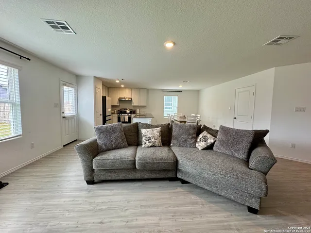 a living room with furniture and a couch