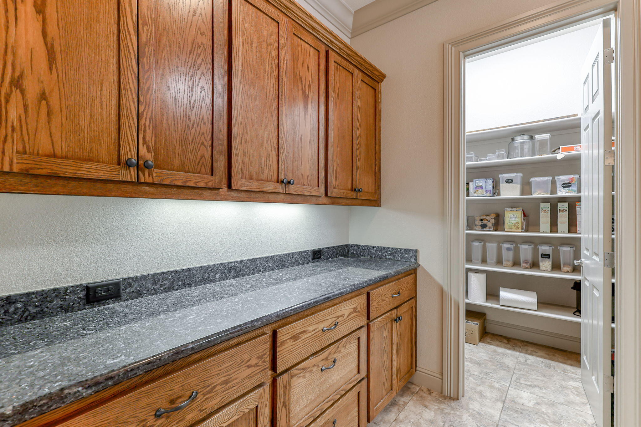 9271 Placer Road Redding, CA 96001 - Photo 16 of 45 a kitchen with granite countertop cabinets and window