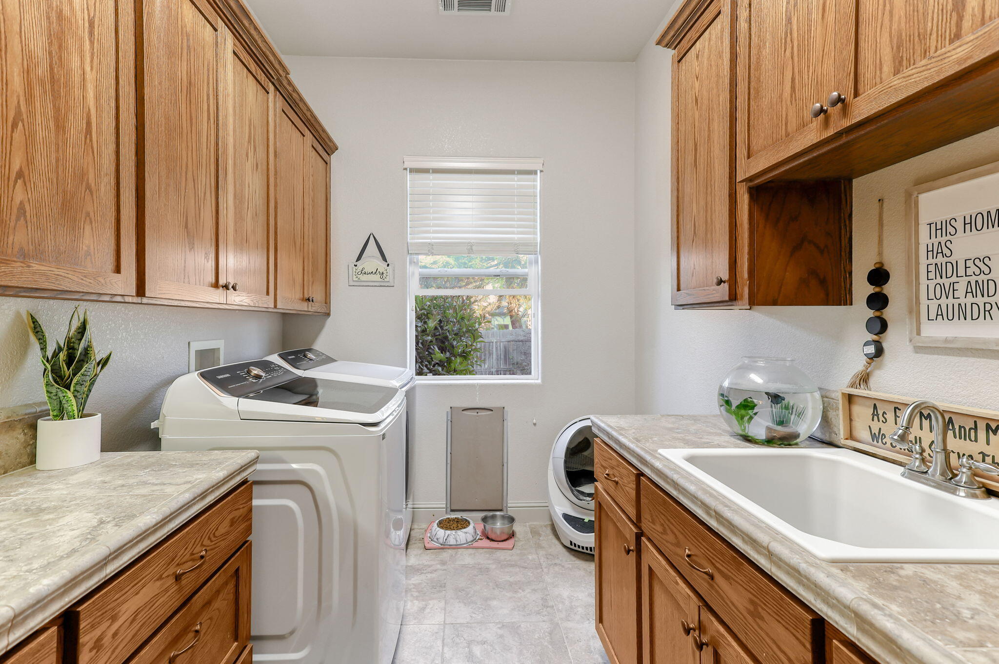 9271 Placer Road Redding, CA 96001 - Photo 17 of 45 a view of a kitchen with sink washer and dryer