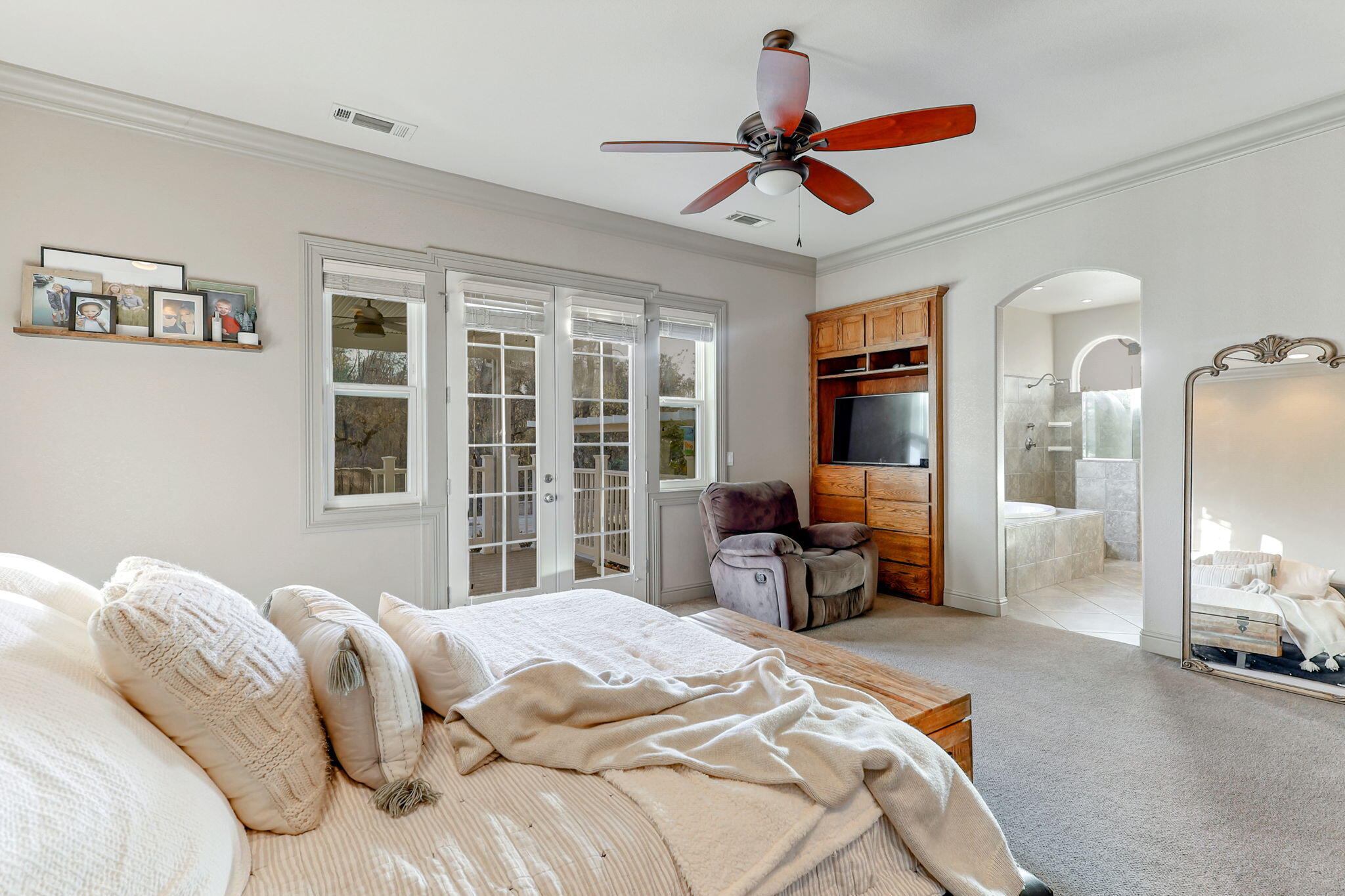 9271 Placer Road Redding, CA 96001 - Photo 24 of 45 a bedroom with a large bed and a large window