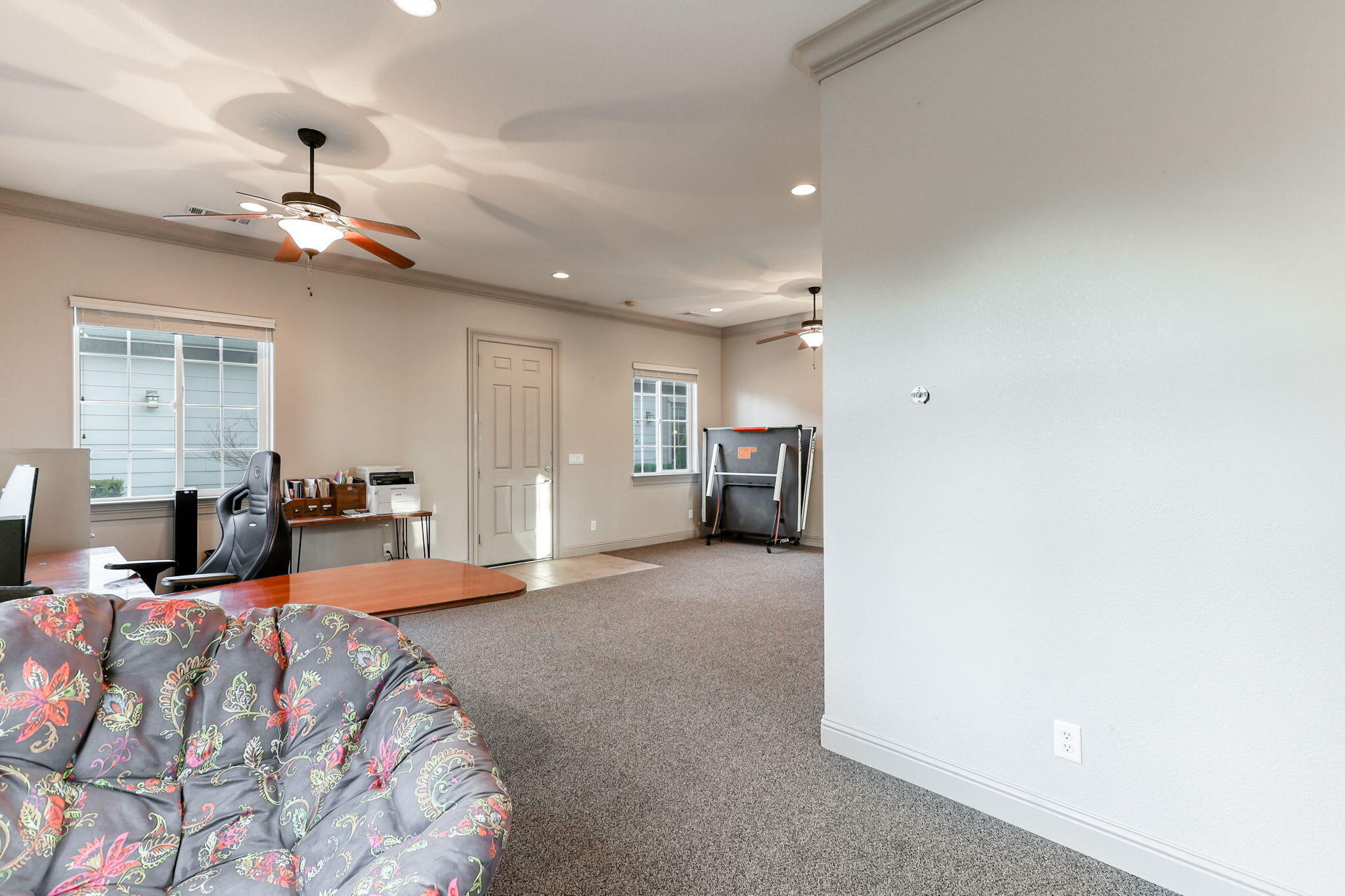 9271 Placer Road Redding, CA 96001 - Photo 36 of 45 a large bedroom with bed and a chandelier