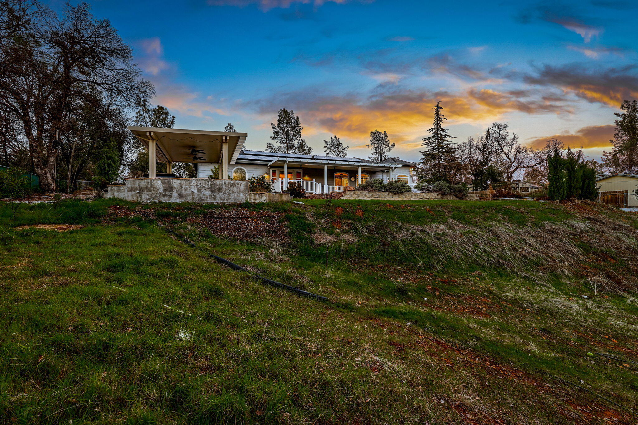 9271 Placer Road Redding, CA 96001 - Photo 42 of 45 a front view of a house with a garden