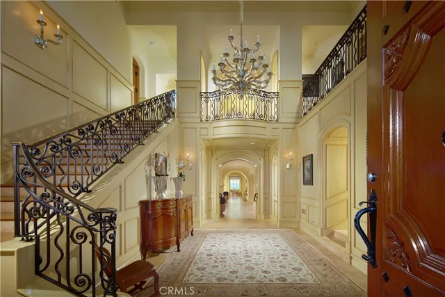 a large kitchen with kitchen island a sink a counter space and stainless steel appliances